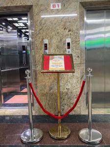 a red ribbon on a platform in a subway station at Thiên Tài Hotel in Ho Chi Minh City
