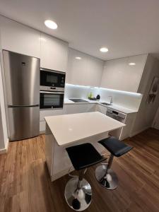 Kuchyňa alebo kuchynka v ubytovaní Apartamento Arousa Mar