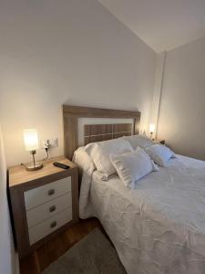 Posteľ alebo postele v izbe v ubytovaní Apartamento Arousa Mar