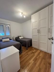 Posteľ alebo postele v izbe v ubytovaní Apartamento Arousa Mar