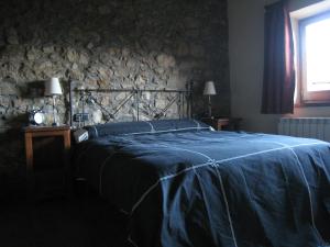 Postel nebo postele na pokoji v ubytování Ca l'Escolà