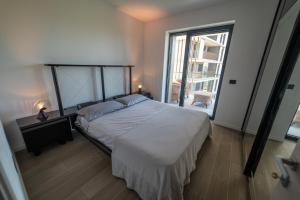Postel nebo postele na pokoji v ubytování @UptownLiving