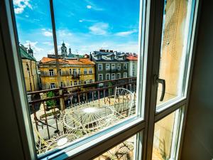 a view of a city from a window at Hostel Pod Basztą in Lublin +56 photos