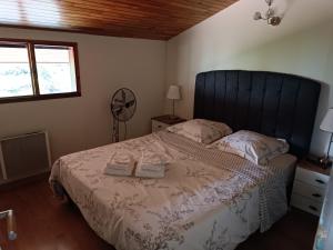 a bedroom with a bed with two towels on it at MagHouse in Cestas +25 photos