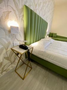 Postel nebo postele na pokoji v ubytování Hotel Liu
