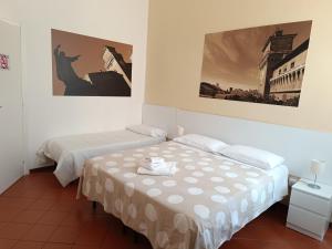 Downtown - Camere in Centro客房内的一张或多张床位
