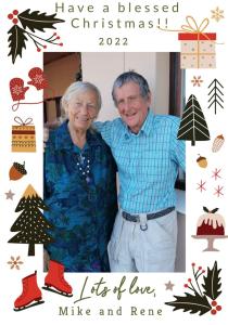an older couple posing for a picture with christmas decorations at Panoramic Blue B&B in Plettenberg Bay