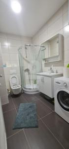 a bathroom with a shower and a toilet and a sink at Luxury apartment Sunny place in Mostar