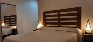 Voodi või voodid majutusasutuse Hotel Makasa toas