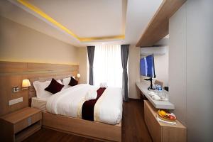 Voodi või voodid majutusasutuse Divine Kathmandu Hotel toas