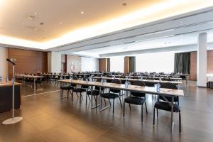 a large room with tables and chairs in it at Hotel Ciudad de Móstoles in Móstoles