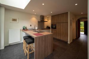 a kitchen with a large island with a counter top at Ten Hove Brugge in Bruges