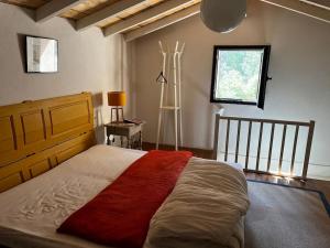 a bedroom with a large bed and a window at Véritable Bastidon Provençale in Le Tholonet