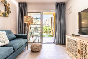 a living room with a couch and a table at Strahouse Stilish House in Maspalomas