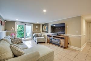 a living room with a couch and a tv at New Fairfield Vacation Rental with Lake Views! in New Fairfield