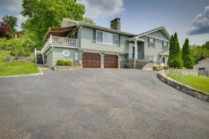 a house with a driveway in front of it at New Fairfield Vacation Rental with Lake Views! in New Fairfield