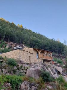 a house on top of a mountain at Gardunha Stone in Louriçal do Campo