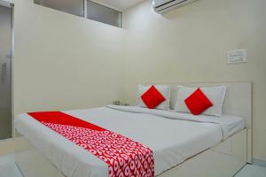Postel nebo postele na pokoji v ubytování Hotel O B Happy Homely Stay