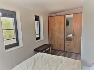 Postel nebo postele na pokoji v ubytování Kleine-Ostseeliebe 2