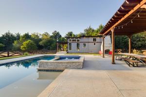 a swimming pool with a patio and a house at Tree-Lined Whitney Cabin about 11 Mi to Lake Whitney! in Whitney