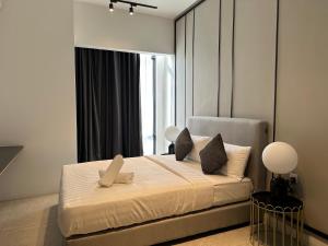 Voodi või voodid majutusasutuse The Axon Suites Bukit Bintang KLCC By SKYSCRAPER toas