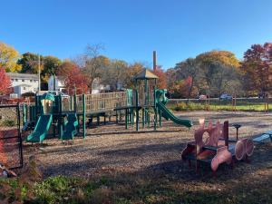 a park with a playground with a slide at Luxury 3 bdr apt with backyard and off-street parking in Watertown