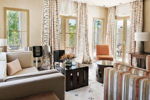 a living room with a couch and a chair at The Villas at Bahia del Duque in Adeje