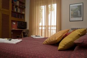 A bed or beds in a room at B&B La Cittadella Univeristaria Policlinico Catania