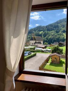 a window with a view of a mountain view at Casa Serena in Siror