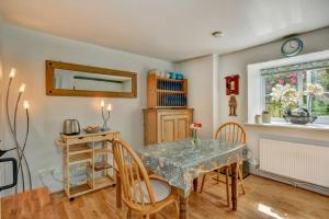a dining room with a table and chairs at Tranquil Apartment at Ashton in Sidmouth