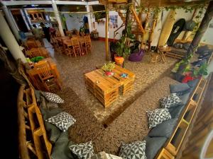an overhead view of a living room with a couch and a table at Huitzilin Hostal in Brisas de Zicatela