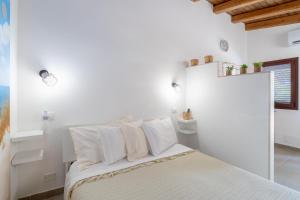 Postel nebo postele na pokoji v ubytování Siracusa mare
