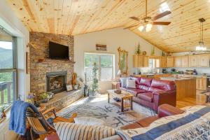 a living room with a couch and a fireplace at North Carolina Cabin - Pool Table and Mountain Views in Murphy