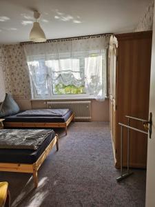 Postel nebo postele na pokoji v ubytování Gästehaus3land in Weil am Rhein