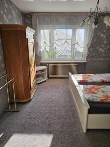 Postel nebo postele na pokoji v ubytování Gästehaus3land in Weil am Rhein