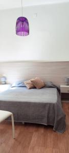 Cama o camas de una habitación en Il Quadrifoglio Room& Suite