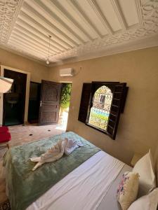 A bed or beds in a room at Riad Rime Garden Marrakech