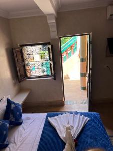 A bed or beds in a room at Riad Rime Garden Marrakech