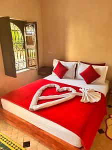 A bed or beds in a room at Riad Rime Garden Marrakech