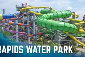 a water park with the words rapids water park at Saltwater pool, FREE beach passes & GREAT location! in Boynton Beach