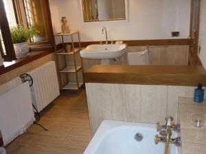 a bathroom with a sink and a bath tub at La Valle dei Gobbi in Monsummano Terme +38 photos