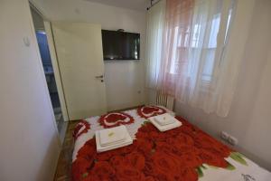 Postel nebo postele na pokoji v ubytování Apartman Isidora