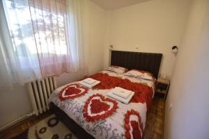 Postel nebo postele na pokoji v ubytování Apartman Isidora