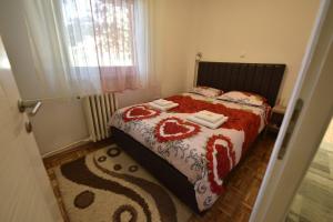 Postel nebo postele na pokoji v ubytování Apartman Isidora