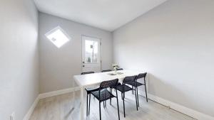 a dining room with a table and chairs at Newly Renovated 3 Bedroom in Hamilton