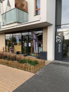 a store front of a building with a sign on it at Baltic Apartment in Gdańsk