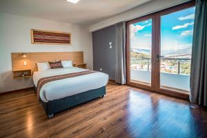 Katil atau katil-katil dalam bilik di Ayni Cusco Hotel