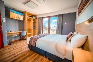 Katil atau katil-katil dalam bilik di Ayni Cusco Hotel