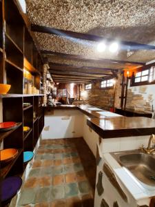 a large kitchen with a sink and a counter at Casa María Vivienda Vacacional in Adeje