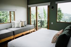 Voodi või voodid majutusasutuse Hotel La Palma y El Tucán - Café y Naturaleza toas
